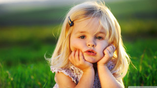 Little girl grass hands face 2 - a little girl free wallpaper