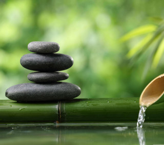 Bamboo mat paddle rocks stack - environmental art free wallpaper