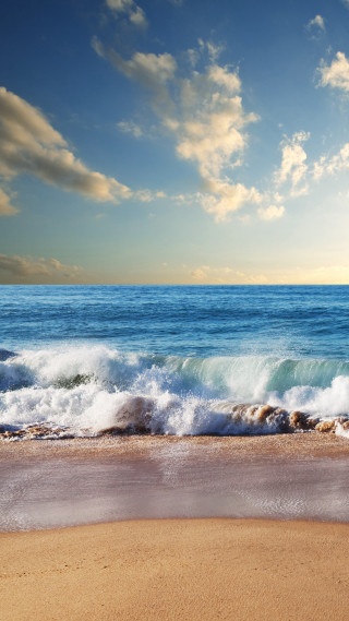 Beach waves sand blue sky - the sand free wallpaper