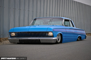 Blue car parked road building - low free wallpaper