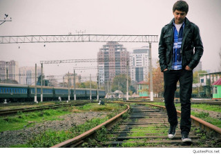 Man standing train track city 3 - western free wallpaper