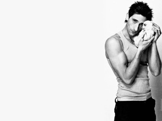 Man holding cat white wall - a cat free wallpaper