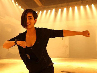 Woman dancing large room stage - a spotlight free wallpaper