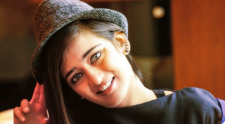 Woman hat cellphone smiling camera - movie still frame free wallpaper