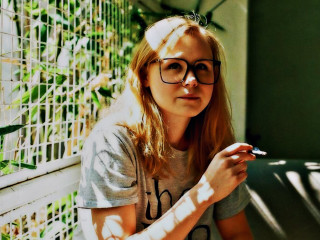 Woman glasses bench smoking cigarette - eugeen van mieghem free wallpaper