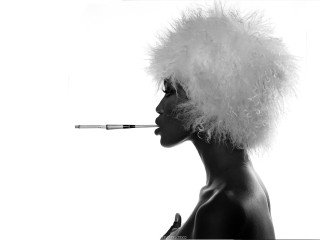 Woman feather hat smoking cigarette - a white background free wallpaper