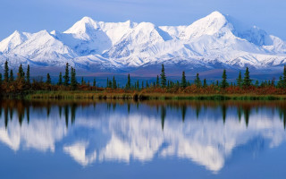 Mountain range reflection lake trees 2 - a blue sky in the background free wallpaper for desktop