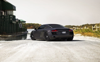 Black sports car gravel road - a green roof free wallpaper