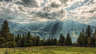 Mountain range fence forest sunlight - crepuscular ray free wallpaper