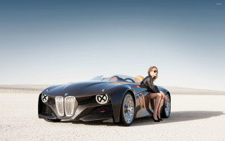 Woman sitting black car desert - panfuturism free wallpaper
