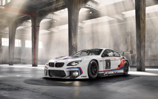White bmw parking garage columns - a parking garage free wallpaper