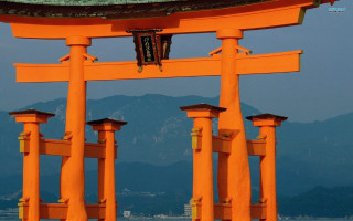 Large orange structure clock mountains - the background in the distance free wallpaper