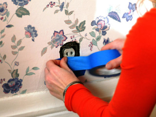 Woman blue tape attach wallpaper 2 - anne rigney free wallpaper