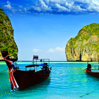 Two boats water rock formation - near free wallpaper