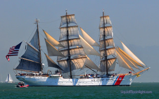 Large white sailboat flag ocean - real free wallpaper