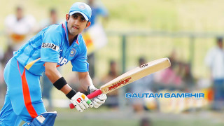 Man holding bat blue uniform - a man holding free wallpaper