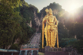 Golden statue person holding staff - stair free wallpaper