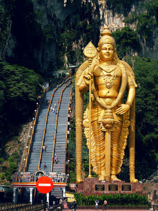 Golden statue god mountain stairs - bronze free wallpaper