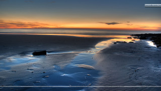 Sunset beach water rocks background - the foreground and a body of water free wallpaper