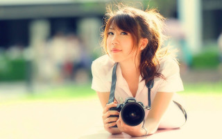 Woman camera laying ground legs - photographic free wallpaper