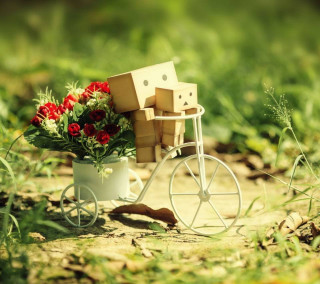Small cart flowers boxes grass - a tilt shift photo free wallpaper
