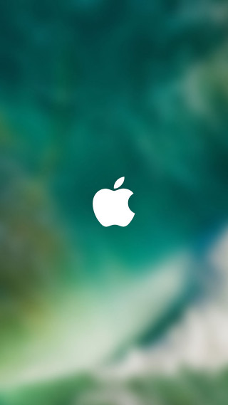 Blurry apple logo green background - free technology wallpaper