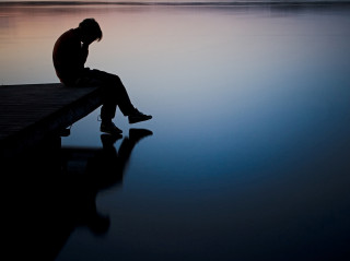 Person sitting dock head down 2 - their head free wallpaper