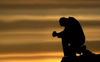 Statue person cross sunset sky - the background and a person free wallpaper