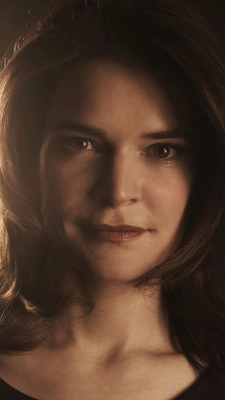 Serious woman expression shoulders focused - serious free wallpaper