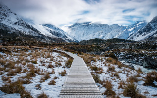 Wooden walkway snowy field mountains - the background free wallpaper for desktop