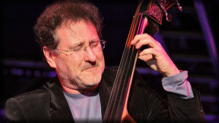 Man holding bass serious look - ben zoeller free wallpaper