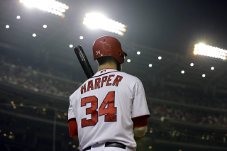 Baseball player bat stadium night - a baseball player holding free wallpaper