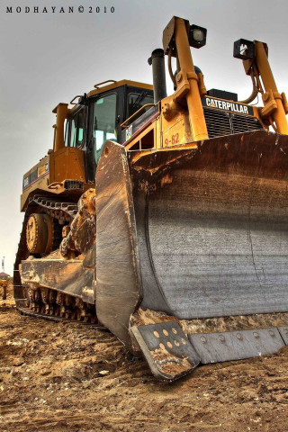 Bulldozer parked dirt field sky - hard surface free wallpaper