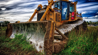 Bulldozer parked field cloudy sky 2 - cloudy free wallpaper