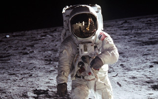 Astronaut walking moon helmet glove 2 - his hand and a helmet free wallpaper