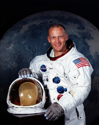 Man white space suit smiling - head and shoulders portrait free wallpaper