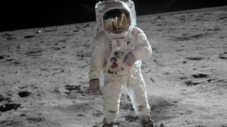 Astronaut standing on moon foot - his foot free wallpaper