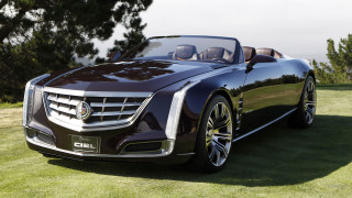 Black car lush green field - luxury free wallpaper