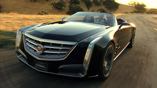 Black car driving road grass - a black car free wallpaper for desktop