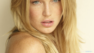 Woman blonde hair blue eyes 17 - a white wall free wallpaper