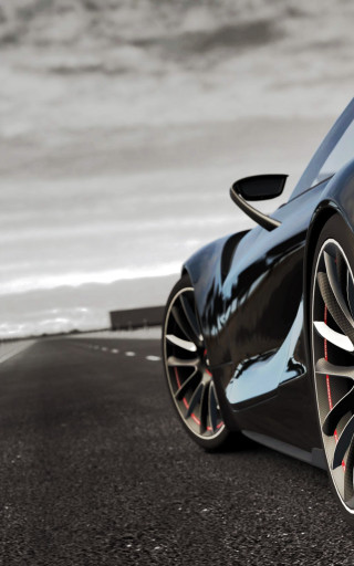 Black sports car ocean road - near free wallpaper