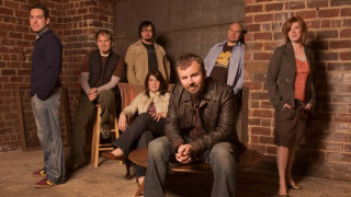 Group people room brick walls - andrew bell free wallpaper