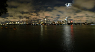 City skyline night water boat 5 - a boat in the foreground free wallpaper