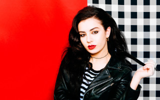Woman long black hair striped - a red wall behind her free wallpaper