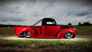 Red truck dirt road grass - a red truck free wallpaper