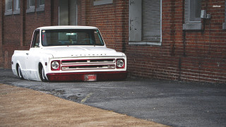 White truck brick building street - a street corner free wallpaper
