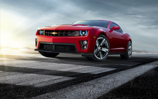 Red car driving road cloudy - a sun free wallpaper