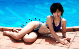 Woman bikini sitting pool water - the ground next free wallpaper
