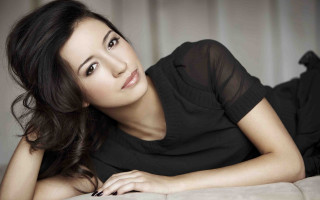 Woman laying bed hand chest - contemporary fashion free wallpaper
