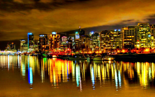 City skyline reflection night cloudy - a few boat free wallpaper